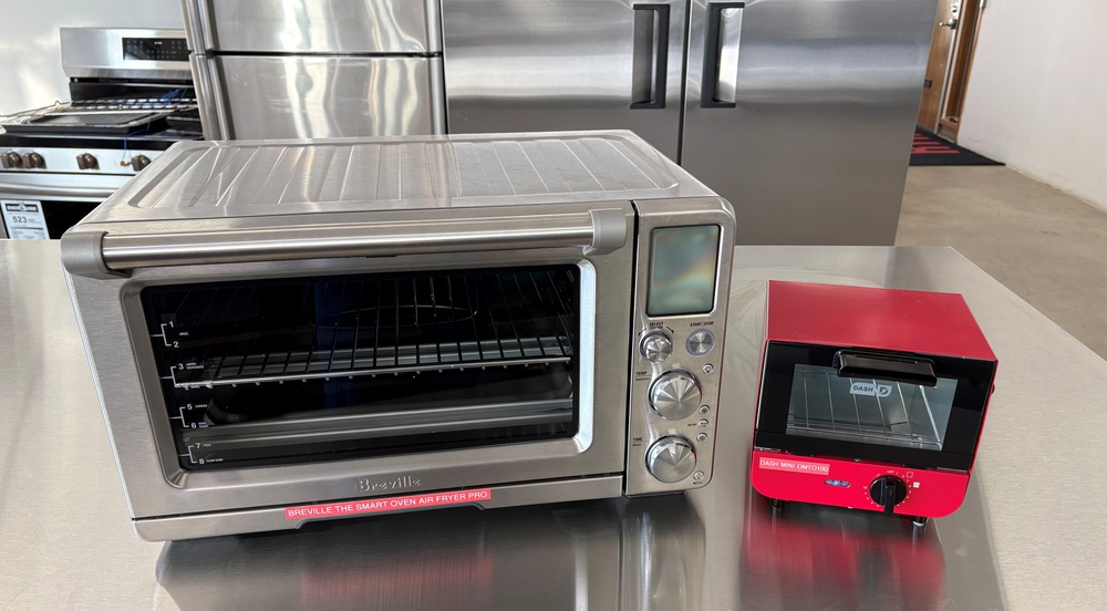 Side-by-side comparison of a Breville The Smart Oven Air Fryer Pro and a Dash Mini Toaster Oven.