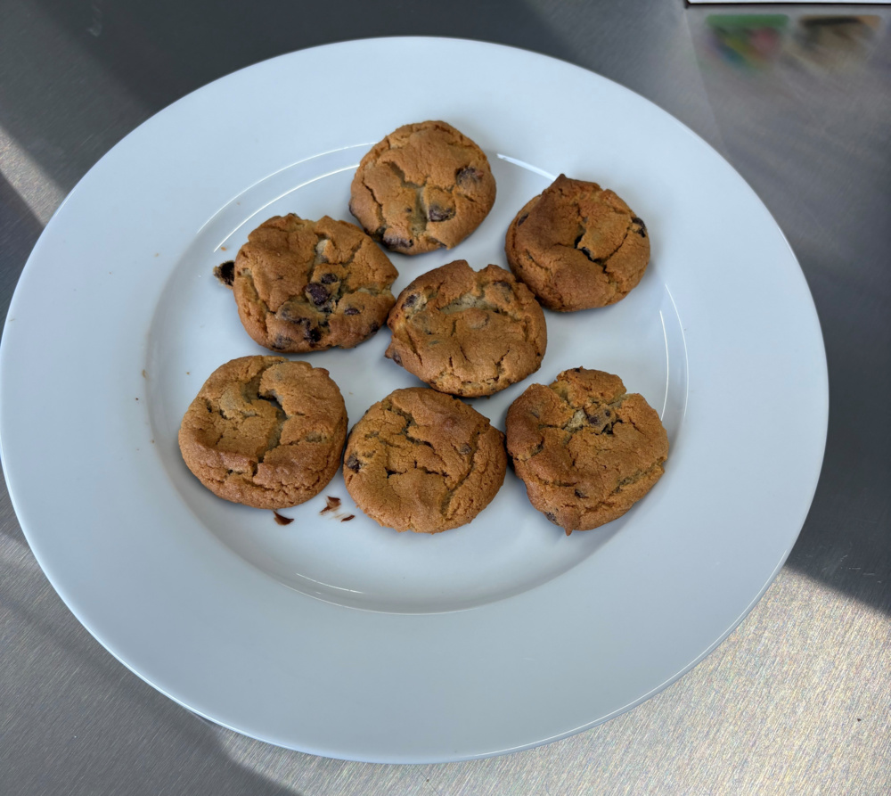 Cookies baked in the Ninja Foodi DZ071 after 7.5 minutes, showing ruptured top surfaces.
