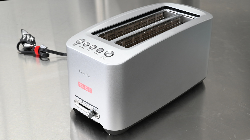 A fully cleaned toaster sitting on a counter.