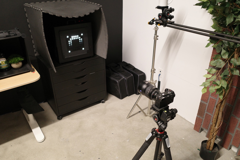Test setup with a camera on a tripod and illuminated dynamic range test chart